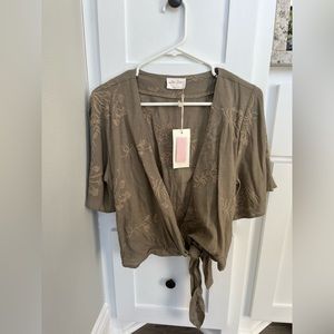 NWT boutique brand wrap top. Size small.